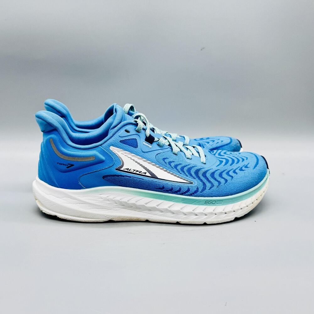 Altra women's light blue running shoes with white trim